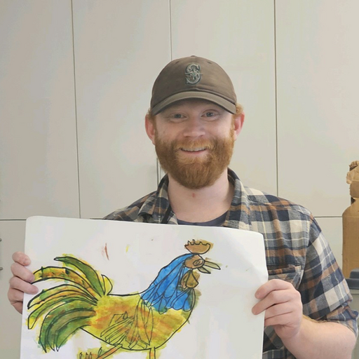 Ross holding up a painting of a rooster